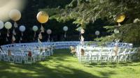 Circular ceremony set -up with extra large balloons and tissue strands